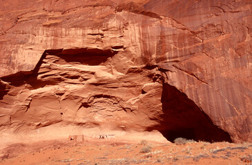 Traces of houses under the red rock mountain