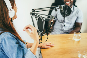 Female host speaker making a podcast interview during live streaming - Technology trends and...