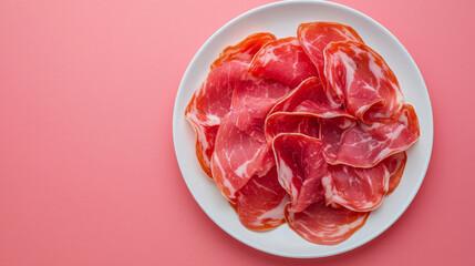 Obraz premium Fresh raw meat slices arranged on plate, showcasing vibrant colors