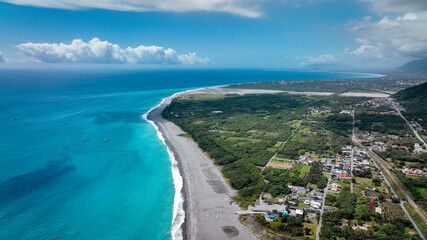 Aerial view of Taiwan coastline with lush greenery and clear waters