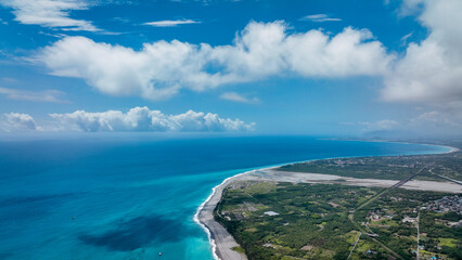 Fototapeta premium Aerial view of Taiwan stunning coast with vibrant waters and lush greenery