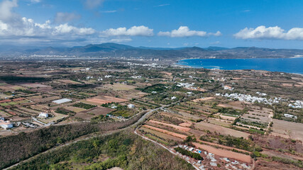 Aerial view of Taiwan diverse landscape with mountains and coastline under a clear sky