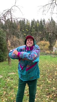 Happy man dancing against nature background.