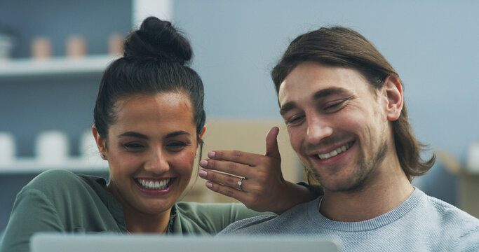 House, engagement and couple with tablet, video call and marriage with connection, love and ring in living room. Apartment, announcement or man with woman on couch, tech and happy with relationship