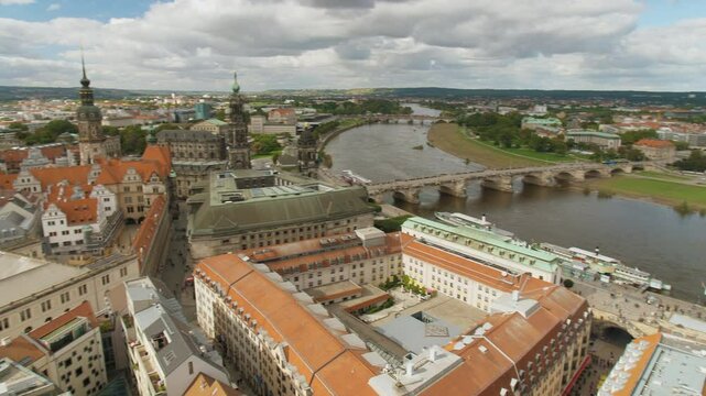 Dresden Semperoper Augustusbr&uuml;cke Hofkirche Residenzschloss Kathedrale Sanctissimae Trinitatis Elbe Germany pan move Aerial View from the top of Frauenkirche cloudy sky with Historic Architecture