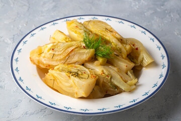 Organic Baked Fennel Bulbs with Salt and Pepper. Fennel dish with olive oil.