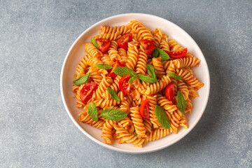 Fusilli pasta, spiral or spirali pasta with tomato sauce - Italian food style