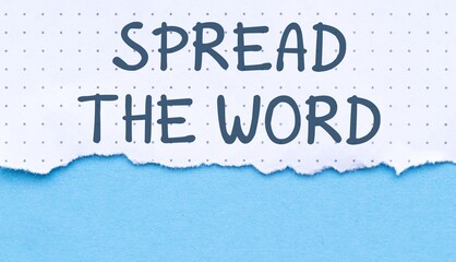 Torn paper with the text Spread the word written on it, isolated on blue background