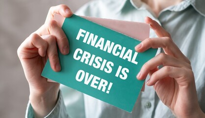 Businesswoman Holding Sign Financial Crisis Over, Symbolizing Economic Recovery