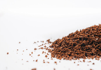 Ground coffee powder or fresh coffee grain isolated on white background