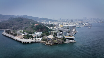 Aerial view of Kaohsiung, Taiwan, highlighting waterfront buildings and nature