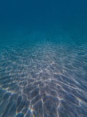 Beautiful water pattern on the ocean sand bottom.