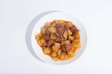 Bacon and potatoes on a white plate