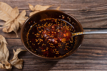 Chili oil dressing in a China bowl