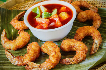 Asian style crispy fried coconut shrimp with a sweet and sour dipping sauce