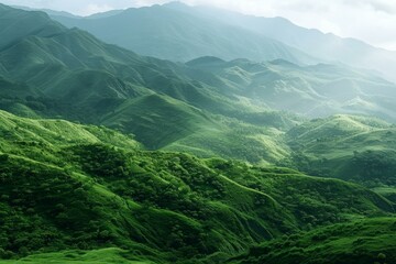 Fototapeta premium Lush green mountains stretching into the distance under cloudy sky