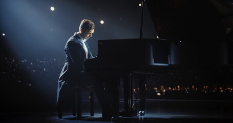 Musician Pours His Heart Into the Grand Piano, Filling the Venue With Soulful Rhapsody. Stage Lights Create a Serene Atmosphere, Enhancing the Emotional Depth of His Classical Performance