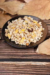 Nutty, fruit-dried cereal mix in a saucer