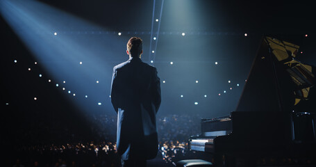 Caucasian Male Pianist Standing Beside the Grand Piano, Receiving Applause and Cheers From the...
