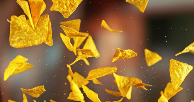Super Slow Motion of Flying Pepper Tortilla Chips. Abstract Blur Interior on Background. Filmed on High Speed Cinema Camera , 1000fps. Speed Ramp Effect.