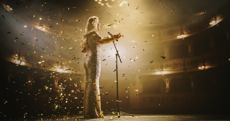 Stage is Getting Covered by Falling Confetti as an Elegant Pop Star Making an Electrifying...