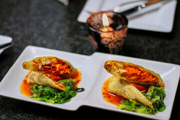 lobster spring rolls served with a spicy dipping sauce