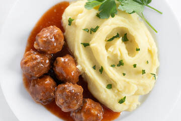 Meatballs with mashed potatoes isolated on white background. Close up