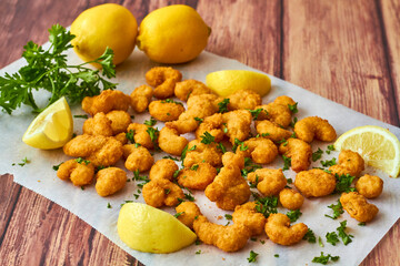popcorn shrimp served with fresh parsley and lemon