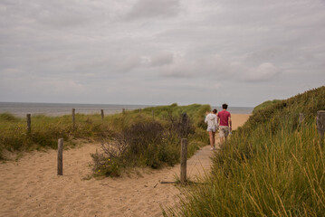 people walking on the beach 