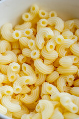 Elbow macaroni texture. Elbow macaroni isolated.  Italian food. 