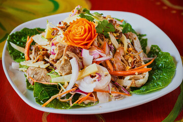 spicy thai style salad with shredded chicken