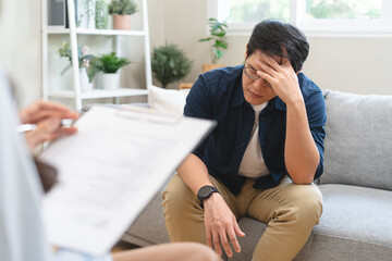Man talking with mentor psychologist in therapy mental health anxiety session.