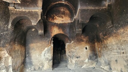 A door and walls of the Virgin Mary Church in the ancient Ayazini Metropolis in Afyonkarahisar, built between 8th and 10th centuries AD, carved into a single tuff rock.