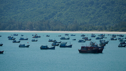 Vietnamese traditional boats at sea at the port in a fishing village near Nha Trang in Vietnam