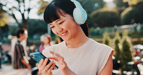 Music, phone and student with Japanese woman in park for streaming, University campus and online...