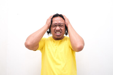 Fototapeta premium Asian man gesture who is feeling headache or migraine and vertigo isolated on white background
