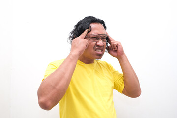 Asian man gesture who is feeling headache or migraine and vertigo isolated on white background