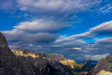 Dolomites mountains nasty weather in autumn with dark cloudy sky before the storm. Black clouds on the sky above the mountain rocky summits and peaks, stormy weather in the Dolomiti Alps, Italy. Extre