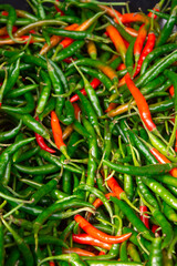 Fresh red and green peppers on the market 
