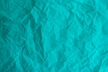 Turquoise abstract light background made of crumpled paper