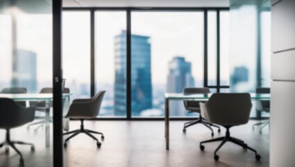 Fototapeta premium Soft blur a modern office with workspace and a blurred view of a high-rise city outside the office window.