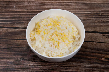 Yellow millet and pearl rice in a small bowl