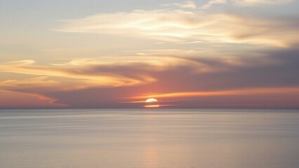 Naklejka premium Serene Sunset Over Calm Ocean Waters: Captivating Beauty for Wall Art, Home Decor, and Mindfulness