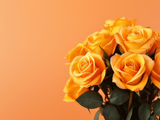 A bouquet of yellow roses against an orange background with space for text
