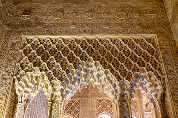 Granada, Spain, Decorative pattern by Islamic-style arches in the Alhambra Palace.