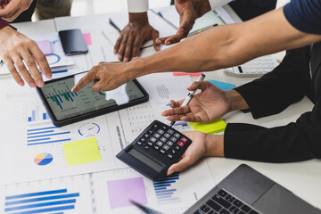 Meeting business people and consultants are discussing financial analysis and market charts to...