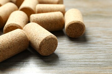 Wine corks on wooden background 