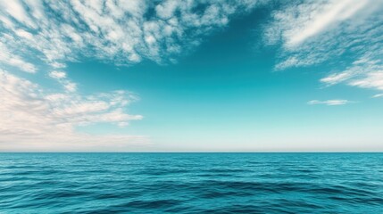 Obraz premium A serene ocean view with calm waves under a clear blue sky, perfect for relaxation and inspiration.