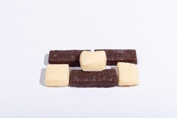 Chocolate and creme candies on a white background