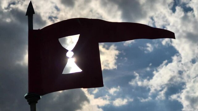 A pennant with a chalice as symbol of Hussite, against the sun rays
